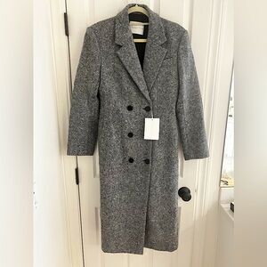 Double breasted long wool coat with cinched waist.